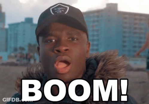 Man In Black Hat And Fur Coat Saying Boom GIF