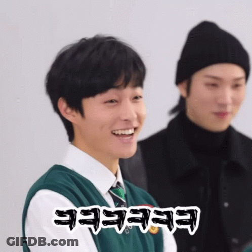 Man In Black Hat And Green Vest Saying Eeeeee GIF