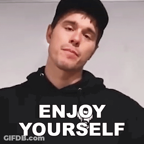 Man In Black Hat And Hoodie Saying Enjoy Yourself GIF