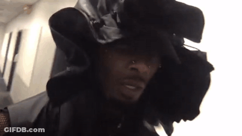 Man In Black Hat And Jacket Looking At Camera GIF