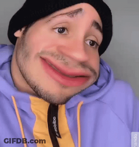 Man In Black Hat And Purple Hoodie Making Funny Face GIF