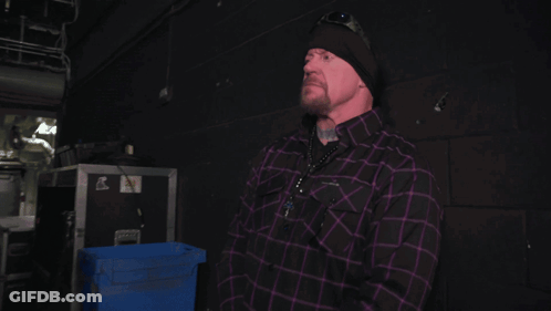 Man In Black Hat And Purple Plaid Shirt GIF