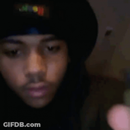 Man In Black Hat And Shirt Holding Cell Phone GIF