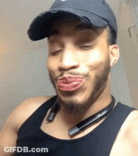 Man In Black Hat And Tank Top Making Funny Face GIF