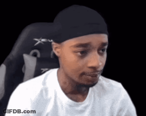 Man In Black Hat And White Shirt Sitting GIF