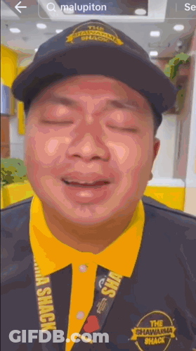 Man In Black Hat And Yellow Shawarma Shack Shirt GIF