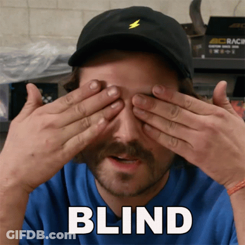 Man In Black Hat Covering Eyes Saying Blind GIF