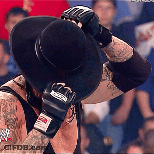 Man In Black Hat Covering Face GIF