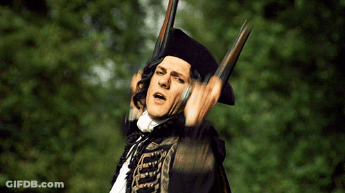 Man In Black Hat Holding Two Guns GIF