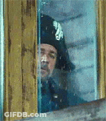 Man In Black Hat Looking Out Window GIF