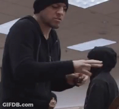 Man In Black Hat Next To Man In Black Jacket GIF
