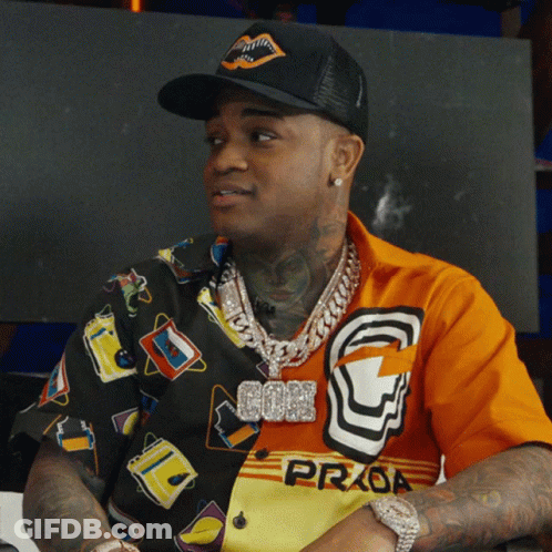 Man In Black Hat Orange Shirt Prada GIF
