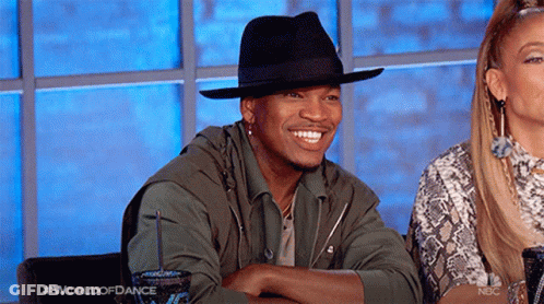 Man In Black Hat Smiling Next To Woman GIF