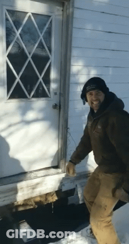 Man In Black Hat Standing In Front Of White Door GIF