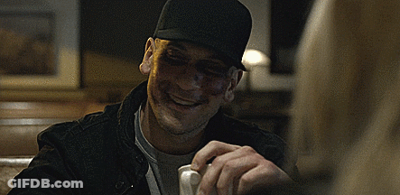 Man In Black Hat With Black Eye And Nose GIF