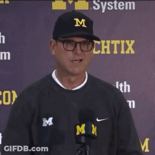 Man In Black Hat With Letter M Thumbs Up GIF
