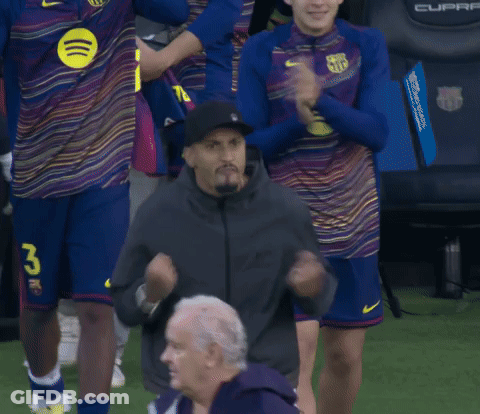 Man In Black Hat With Number 26 In Front Of Soccer Players GIF