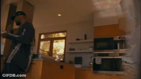 Man In Black Hat With Plate Of Food GIF