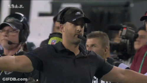 Man In Black Hat With Z Covering Mouth GIF