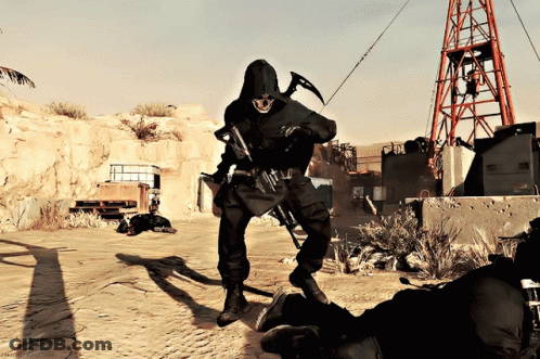 Man In Black Hooded Jacket Holding Hammer And Gun GIF