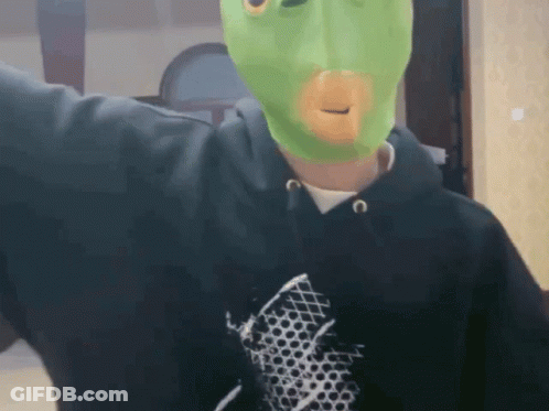Man In Black Hoodie And Green Mask GIF