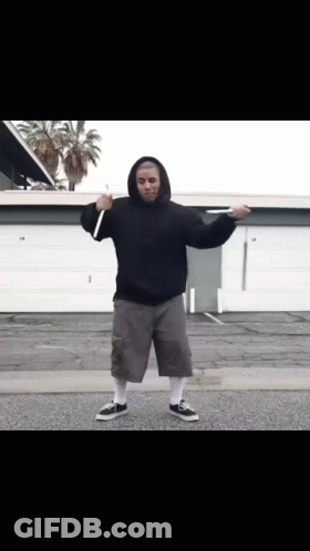 Man In Black Hoodie And Grey Shorts In Front Of Garage Door 29 GIF