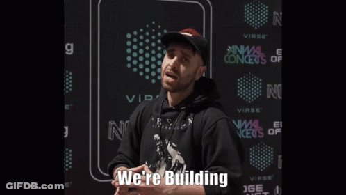 Man In Black Hoodie And Hat Says We're Building GIF