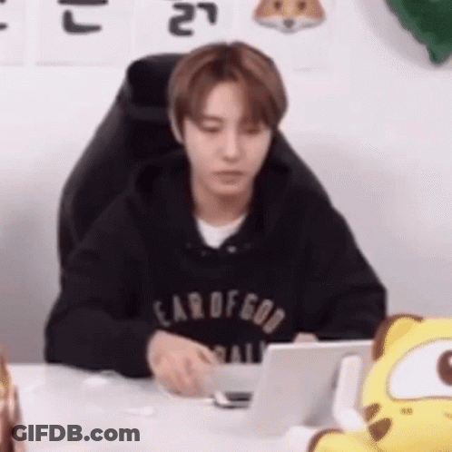 Man In Black Hoodie At Desk With Laptop GIF