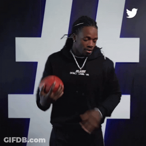 Man In Black Hoodie Holding Football GIF