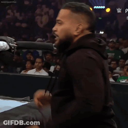 Man In Black Hoodie In Front Of Crowd With W Logo GIF
