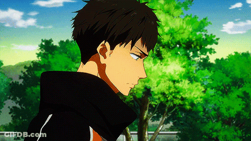 Man In Black Hoodie In Front Of Trees GIF