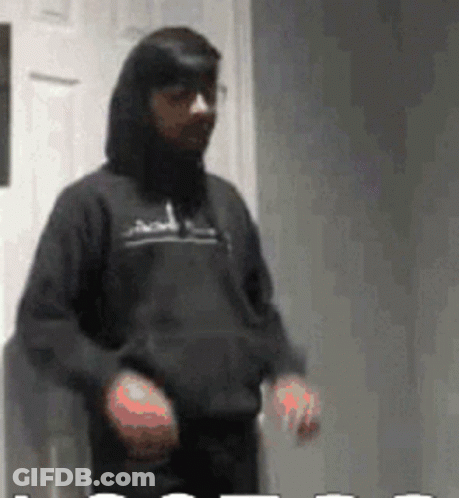 Man In Black Hoodie In Front Of White Door GIF