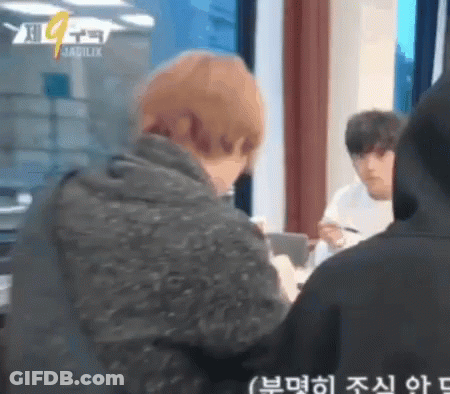 Man In Black Hoodie Looking At Another Man GIF