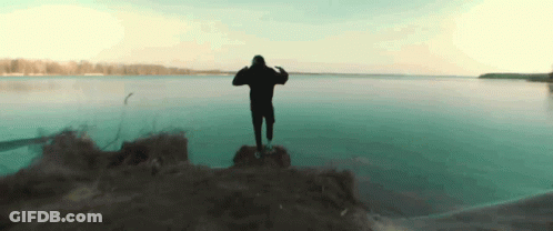 Man In Black Hoodie Overlooking Water GIF