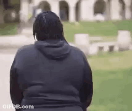 Man In Black Hoodie Standing Near Cemetery GIF