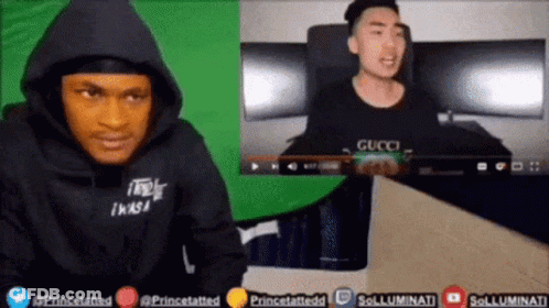 Man In Black Hoodie Watching Video GIF