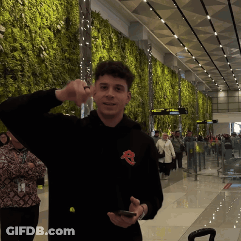 Man In Black Hoodie With Letter R GIF