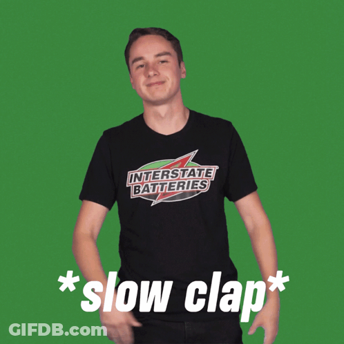 Man In Black Interstate Batteries Shirt GIF