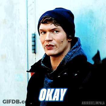 Man In Black Jacket And Blue Beanie Saying Okay GIF
