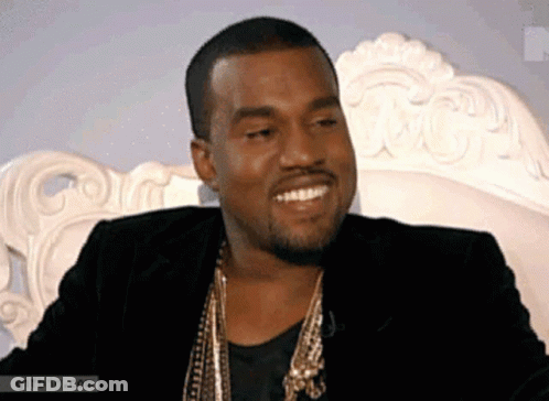 Man In Black Jacket And Gold Necklace Smiling GIF