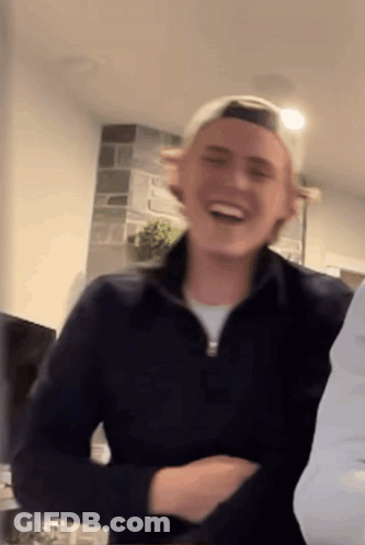 Man In Black Jacket And White Hat Smiling GIF