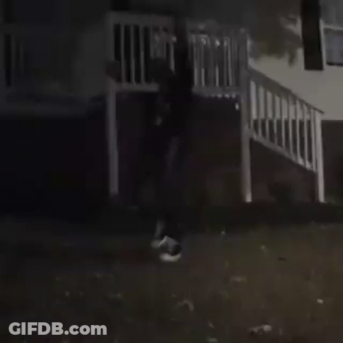 Man In Black Jacket And White Shirt In Dark GIF