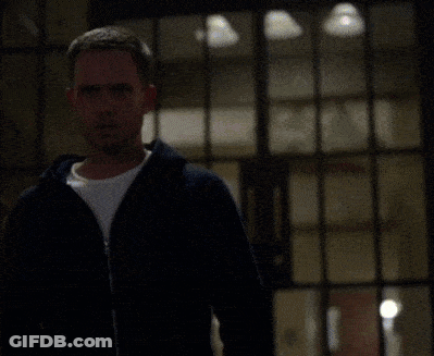 Man In Black Jacket And White Shirt In Front Of Window GIF