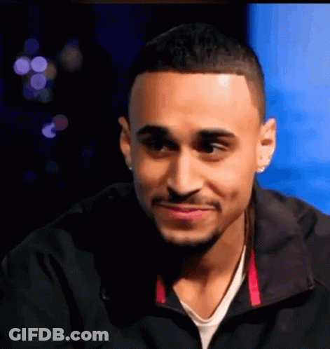 Man In Black Jacket And White Shirt Smiling GIF