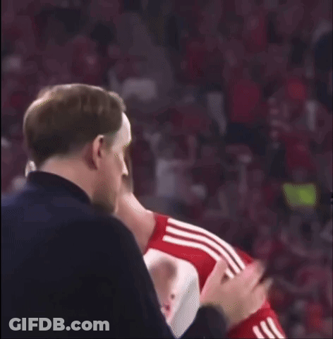 Man In Black Jacket Applauding Soccer Player In Red Shirt GIF
