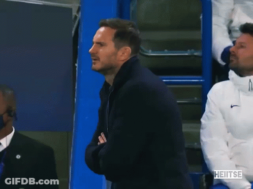 Man In Black Jacket Applauds In Front Of Blue Cooler Saying Heitse GIF