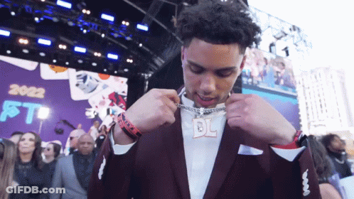 Man In Black Jacket At Microphone With NFL Logo GIF