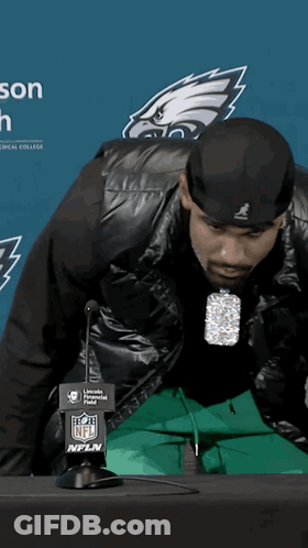 Man In Black Jacket At NFL Logo Microphone GIF