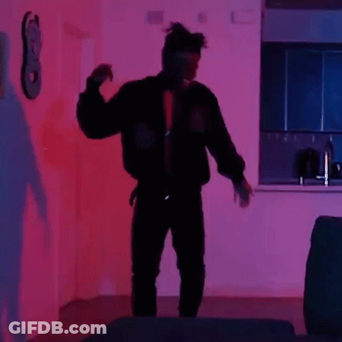 Man In Black Jacket Dancing In Purple Light GIF