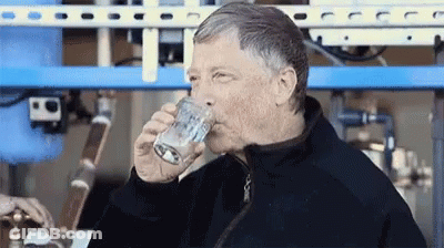 Man In Black Jacket Drinking From Glass GIF
